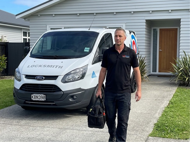 LockSmart Master Locksmith installing a new deadbolt lock on an Auckland home